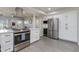 Updated kitchen features stainless steel appliances and ample storage at 4035 E Indianola Ave, Phoenix, AZ 85018