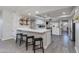 Modern kitchen with breakfast bar and open layout to dining area at 4035 E Indianola Ave, Phoenix, AZ 85018