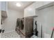 Convenient laundry room with washer, dryer, and overhead cabinets at 4035 E Indianola Ave, Phoenix, AZ 85018