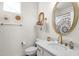 Bright bathroom with gold fixtures, floral shower curtain, and a large mirror at 4141 E Pony Ln, Gilbert, AZ 85295