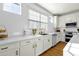 Modern white kitchen with gold accents and quartz countertops at 4141 E Pony Ln, Gilbert, AZ 85295