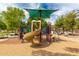 Fun playground with a spiral slide, shaded by an umbrella at 4240 S Splendor Pl, Gilbert, AZ 85297