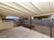 Covered patio overlooking backyard with playset at 547 N 98Th Pl, Mesa, AZ 85207