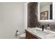 Modern bathroom with marble vanity and herringbone tile at 6525 E Cave Creek Rd # 9, Cave Creek, AZ 85331