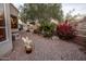 Landscaped backyard with a winding brick path and shed at 741 E Mountain Sage Dr, Phoenix, AZ 85048