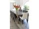 Formal dining room with a long table and neutral colored chairs at 11209 N 45Th Way, Phoenix, AZ 85028