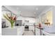 Modern kitchen with white cabinets and a large island at 11209 N 45Th Way, Phoenix, AZ 85028