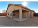 House with backyard patio and gravel landscaping at 12510 W Tonto St, Avondale, AZ 85323