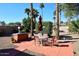 Landscaped backyard with patio and built-in grill at 13854 N Fountain Hills Blvd, Fountain Hills, AZ 85268