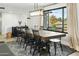 Bright dining area with large windows and farmhouse style table at 1443 W Morrow Dr, Phoenix, AZ 85027