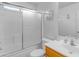 Bright bathroom includes a tub/shower, vanity, and mirror at 14834 W Calavar Rd, Surprise, AZ 85379