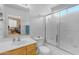 Clean bathroom with a shower/tub combo and wood vanity at 14834 W Calavar Rd, Surprise, AZ 85379