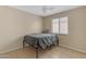 Simple bedroom with a bed and ceiling fan at 14834 W Calavar Rd, Surprise, AZ 85379