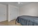 Well-lit bedroom featuring a bed, closet, and ceiling fan at 14834 W Calavar Rd, Surprise, AZ 85379