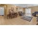 Living room with tiled floors and a large TV at 14834 W Calavar Rd, Surprise, AZ 85379