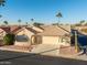 Single-story home with tile roof and desert landscaping at 1560 E Riviera Dr, Chandler, AZ 85249