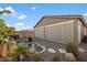 Backyard with covered patio and water feature at 18394 W Ipswitch Way, Surprise, AZ 85374
