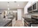 Modern kitchen featuring stainless steel appliances and granite countertops at 18394 W Ipswitch Way, Surprise, AZ 85374