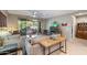 Spacious living room with comfortable seating and access to patio at 18394 W Ipswitch Way, Surprise, AZ 85374