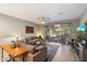 Living area with sliding doors opening to a patio at 18394 W Ipswitch Way, Surprise, AZ 85374
