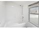 Bathroom with shower/tub combo and window at 1902 S Shannon Dr, Tempe, AZ 85281