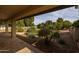 Covered patio provides shaded outdoor seating area at 21310 E Orchard Ln, Queen Creek, AZ 85142