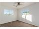 Bright bedroom with neutral carpeting and ceiling fan at 2208 N 35Th St, Phoenix, AZ 85008