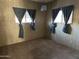 Bedroom with wood-paneled walls and carpeting at 2249 N Shannon Way, Mesa, AZ 85215