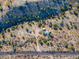 Aerial view of desert lot with a small house and surrounding desert landscape at 26956 N Shirley Rd, San Tan Valley, AZ 85143