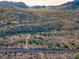 Aerial view of a desert property with a small home and surrounding desert landscape at 26956 N Shirley Rd, San Tan Valley, AZ 85143