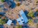 Aerial view of a desert property featuring a home with solar panels at 26956 N Shirley Rd, San Tan Valley, AZ 85143