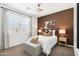 Charming bedroom with accent wall and window seating at 5830 E Smeaton Pl, San Tan Valley, AZ 85140