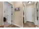 Bright hallway with tile flooring and access to bedrooms and bathroom at 6906 E Sisso Pl, Florence, AZ 85132