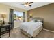 Cozy bedroom with ceiling fan and window at 954 E Westchester Dr, Tempe, AZ 85283