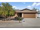 Brick home with a large tree and a two-car garage at 954 E Westchester Dr, Tempe, AZ 85283