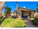 Backyard patio with seating area and grassy lawn at 1778 S Saddle St, Gilbert, AZ 85233