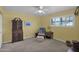 Cozy bedroom with a wooden secretary and ceiling fan at 3301 W Belmont Ave, Phoenix, AZ 85051