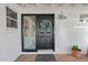 Black front door with sidelights and a stylish wreath at 3301 W Belmont Ave, Phoenix, AZ 85051