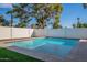 Modern rectangular pool with water features at 3334 E Desert Cove Ave, Phoenix, AZ 85028