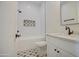 Clean bathroom with white subway tile and patterned floor at 4072 E Weston Ln, San Tan Valley, AZ 85140