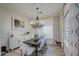 Elegant dining room with chandelier and farmhouse table at 4072 E Weston Ln, San Tan Valley, AZ 85140