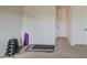 Home gym with treadmill, weights, and storage at 4072 E Weston Ln, San Tan Valley, AZ 85140