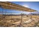 Covered horse shelter with metal roof and gated enclosure at 4072 E Weston Ln, San Tan Valley, AZ 85140