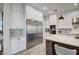 Modern kitchen with white cabinets and stainless steel appliances at 4072 E Weston Ln, San Tan Valley, AZ 85140