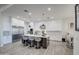 Modern kitchen with white cabinets, large island and stainless steel appliances at 4072 E Weston Ln, San Tan Valley, AZ 85140