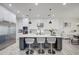 Modern kitchen with white cabinets, large island, and stainless steel appliances at 4072 E Weston Ln, San Tan Valley, AZ 85140