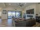 Living room with large sectional sofa and access to backyard at 4072 E Weston Ln, San Tan Valley, AZ 85140