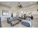 Open living room and kitchen with gray sectional sofa at 4072 E Weston Ln, San Tan Valley, AZ 85140