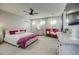 Bright main bedroom featuring a king-size bed and stylish decor at 4072 E Weston Ln, San Tan Valley, AZ 85140
