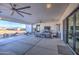 Covered patio with seating area and outdoor TV at 4072 E Weston Ln, San Tan Valley, AZ 85140